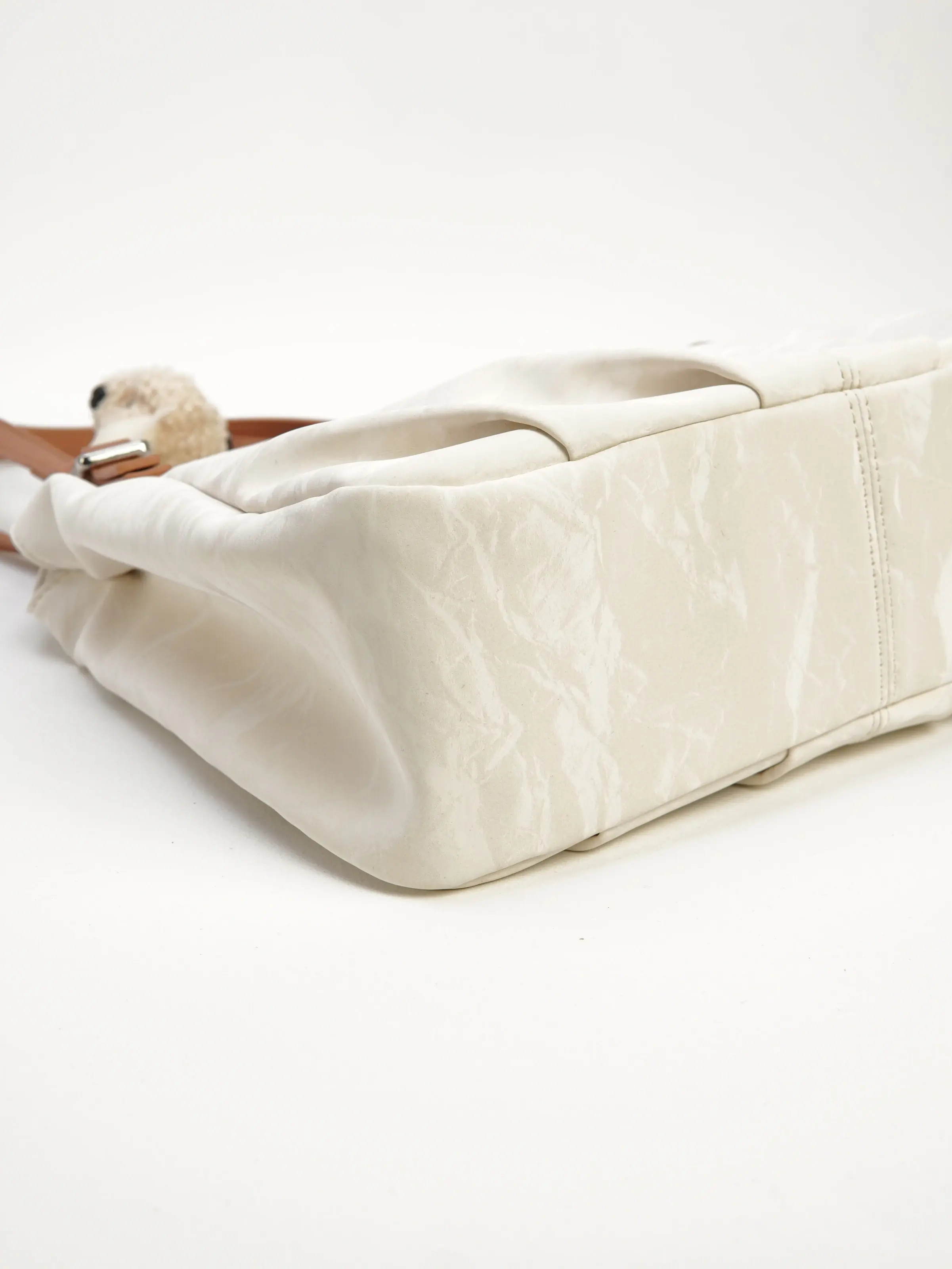 Base of the Elia ivory shoulder bag