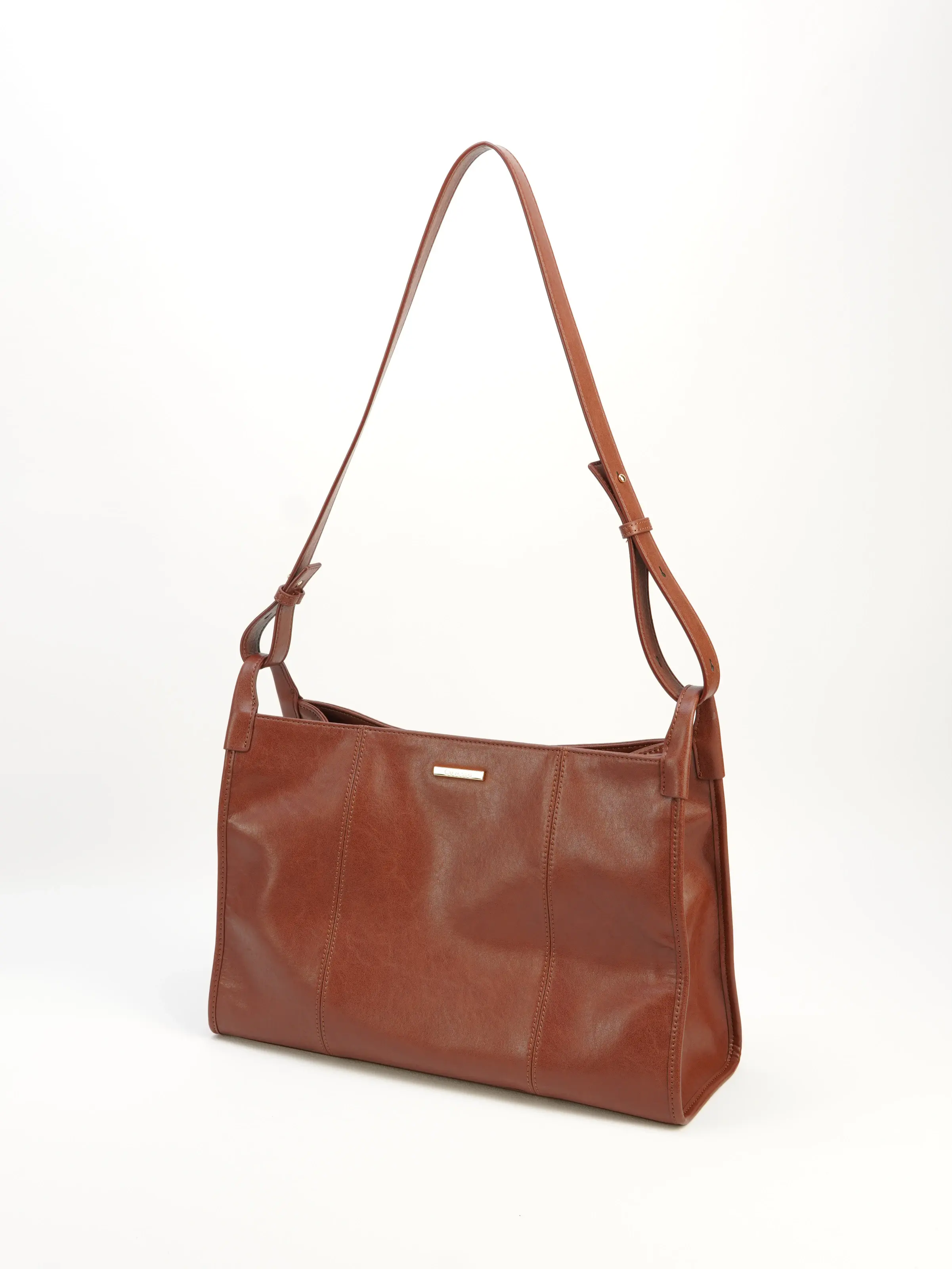 Mara cognac shoulder bag, front three-quarter view with an adjustable strap