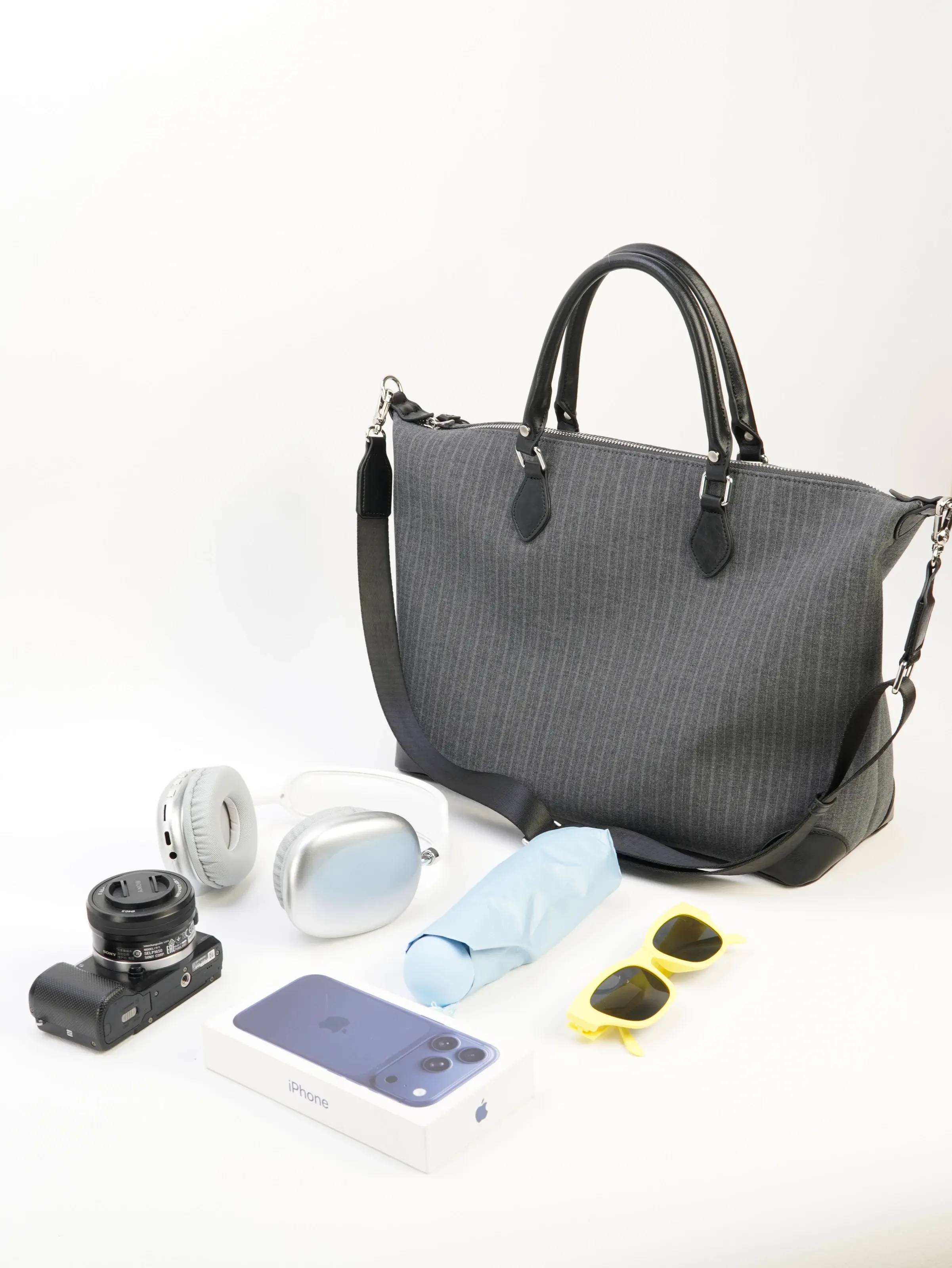 Ellis gray tote bag photographed with everyday objects