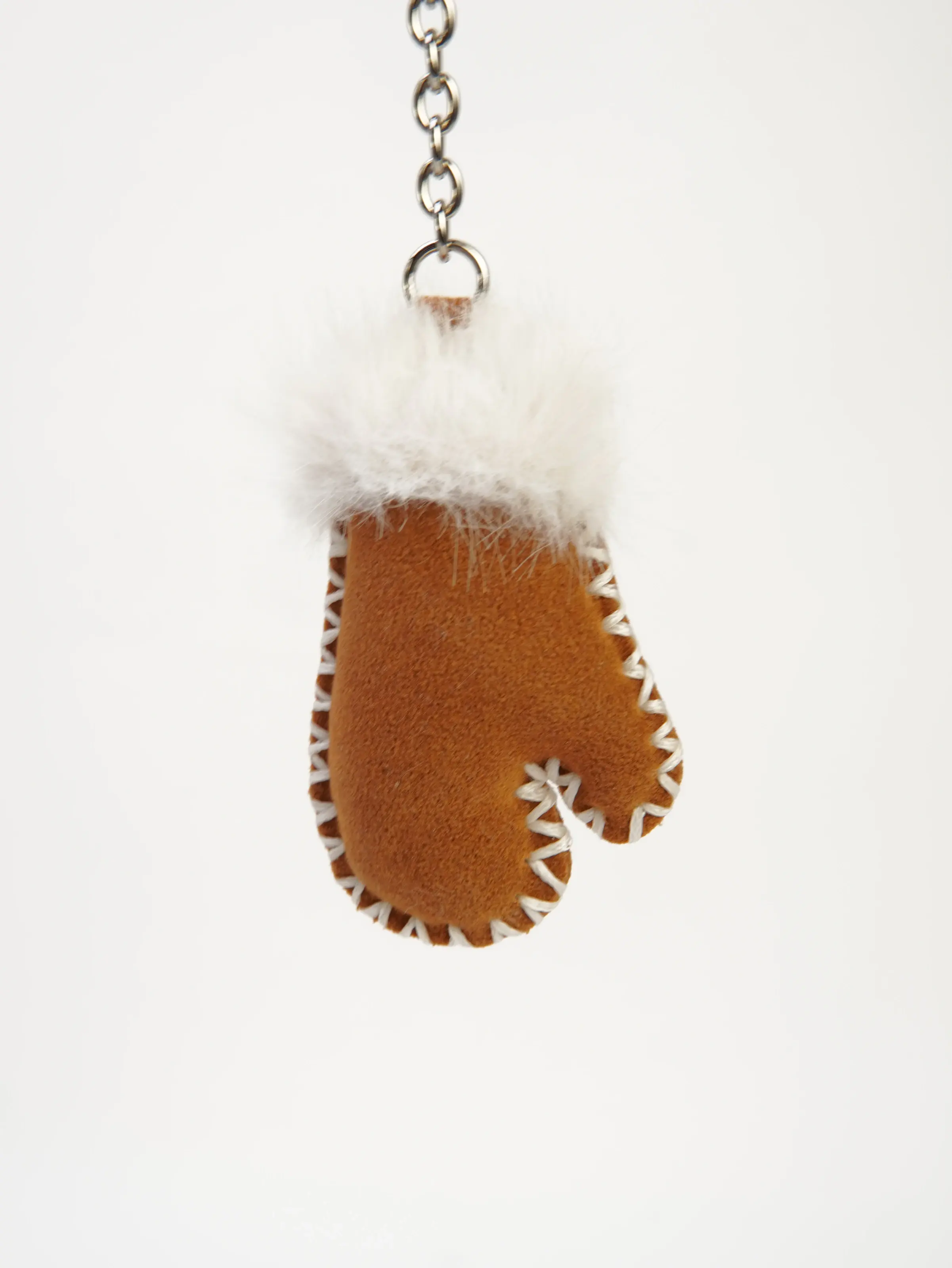 Close view of Milo Mitten Bag Charm with contrast stitching
