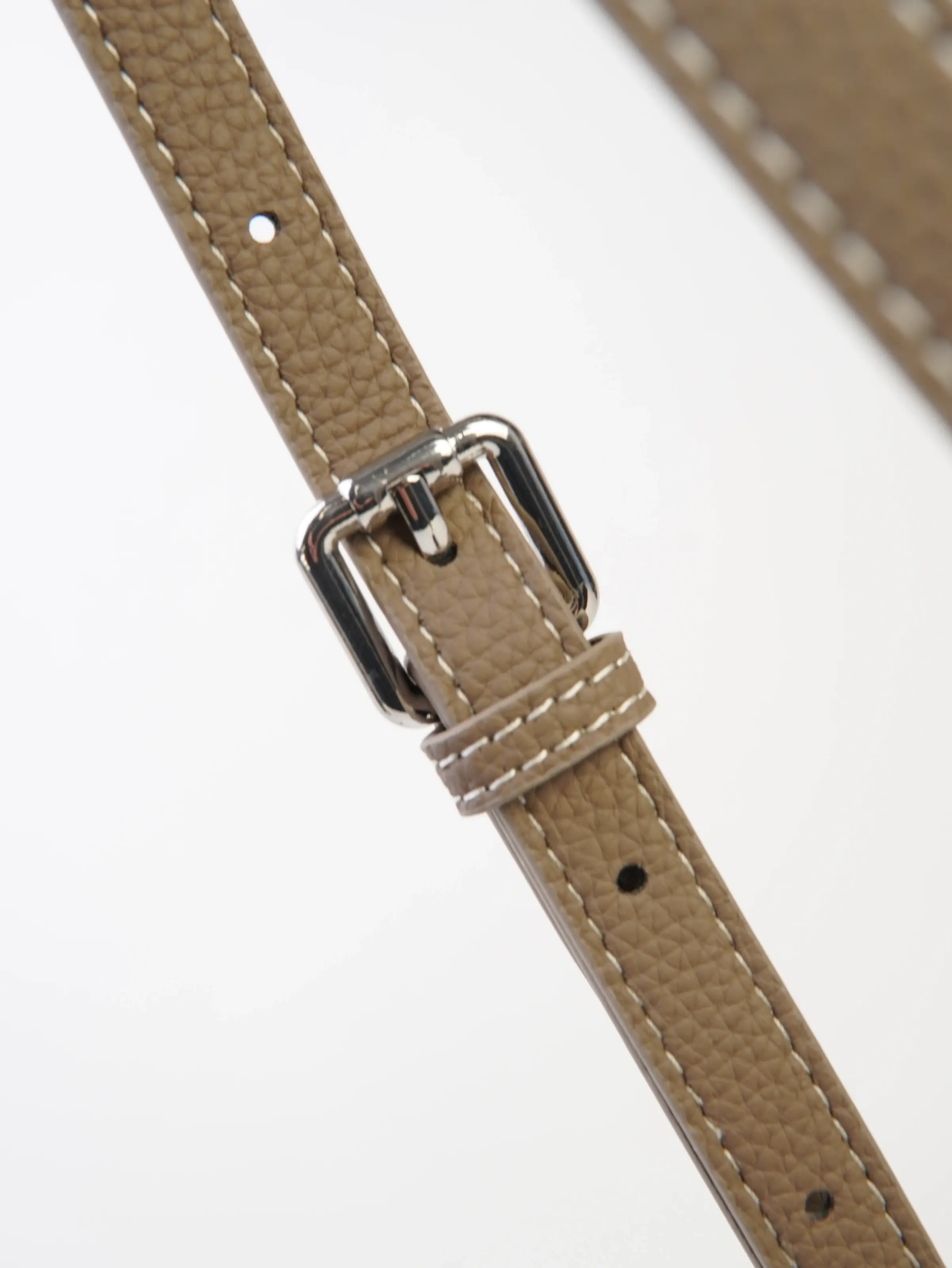 Close view of the adjustable longer strap shown with the Lena tote