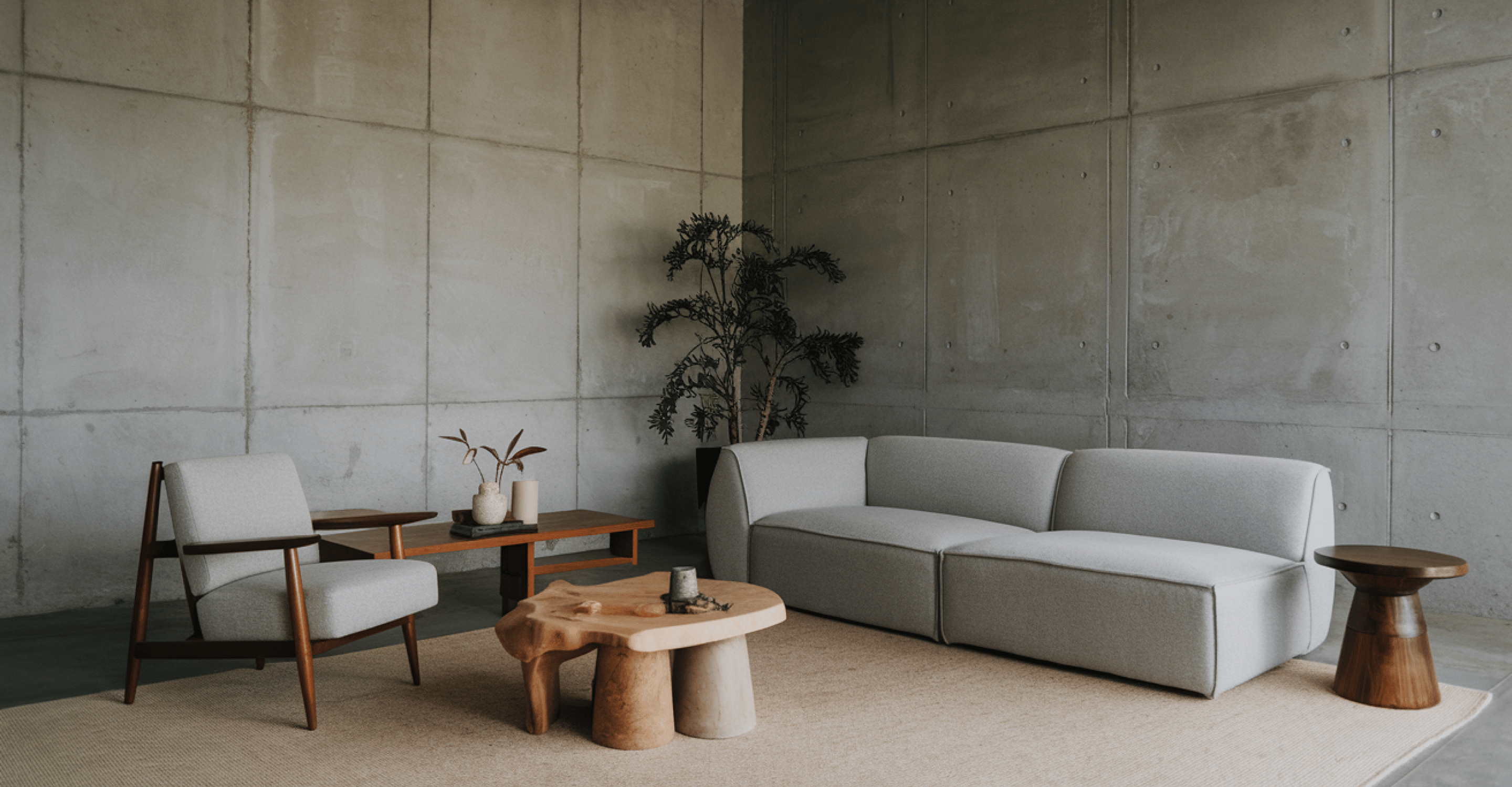 Living room with gray armchair and two-seater sofa