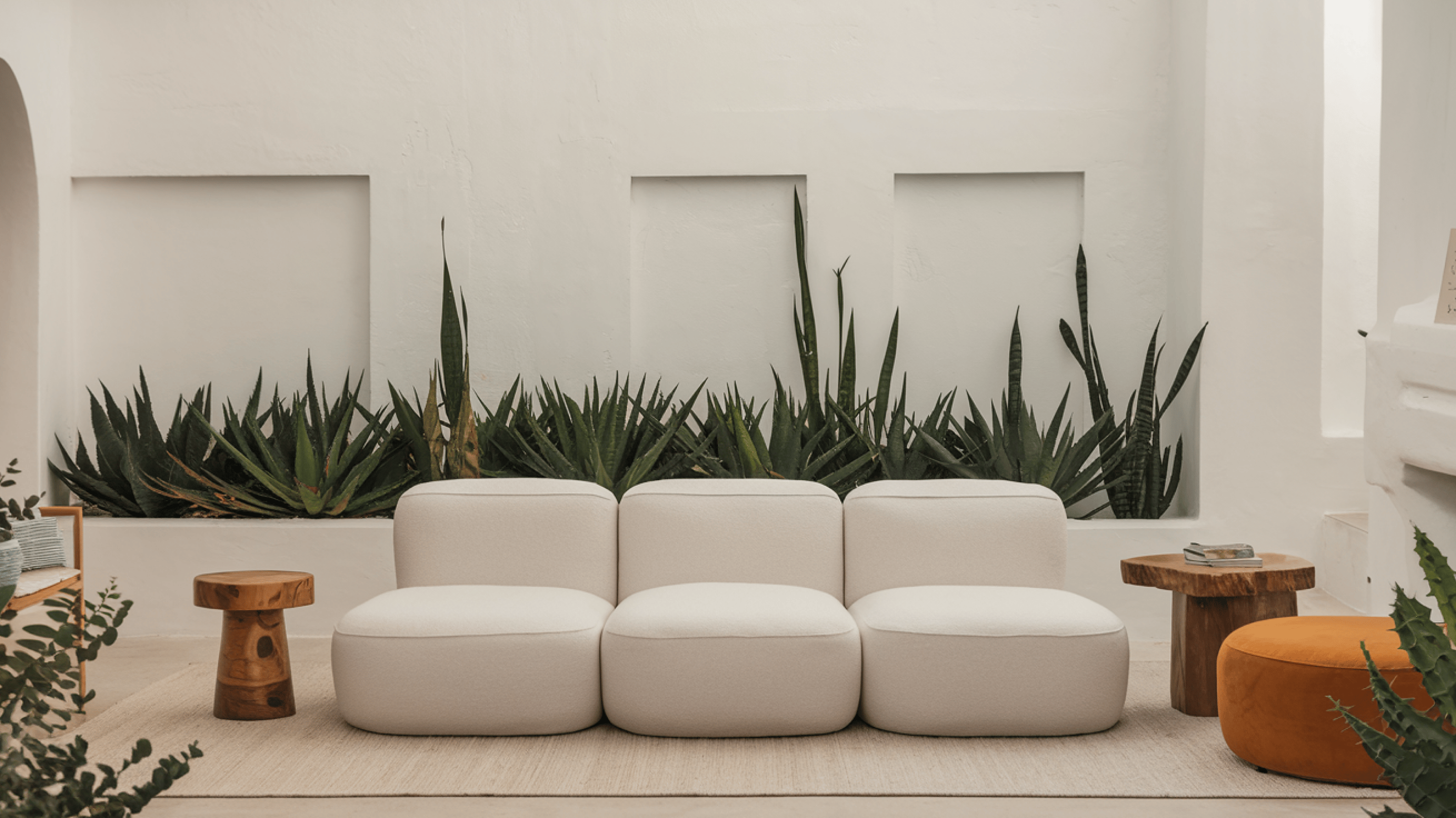 Living room with gray three-seater puffy sofa